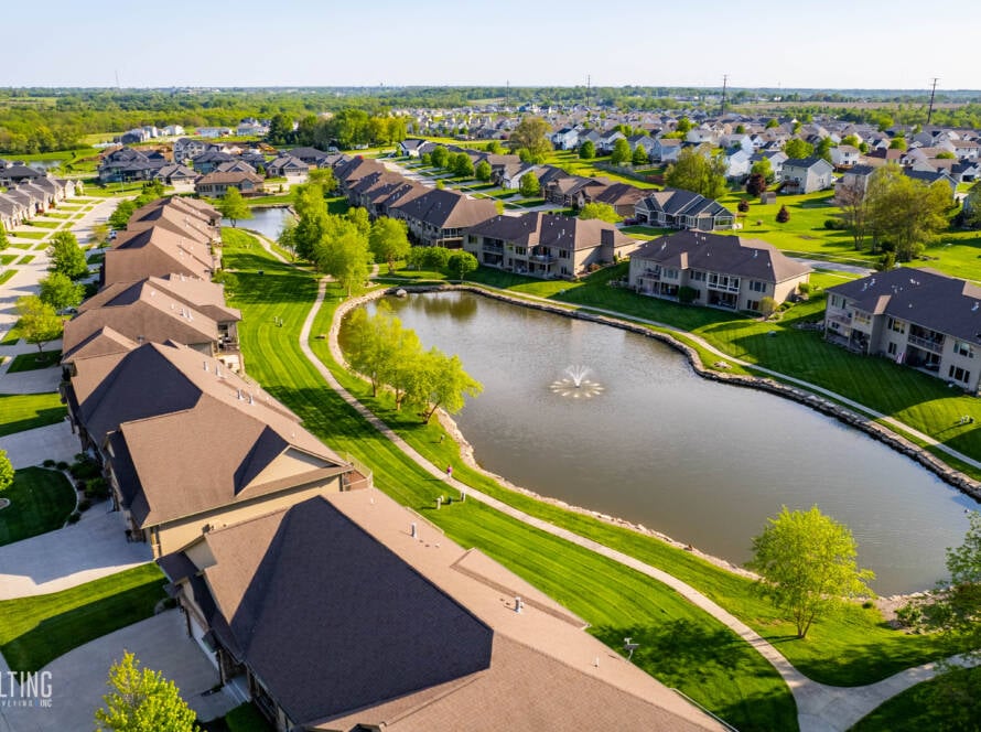 Lovely residential neighborhood with stunning homes, located next to a peaceful body of water, offering serene views.